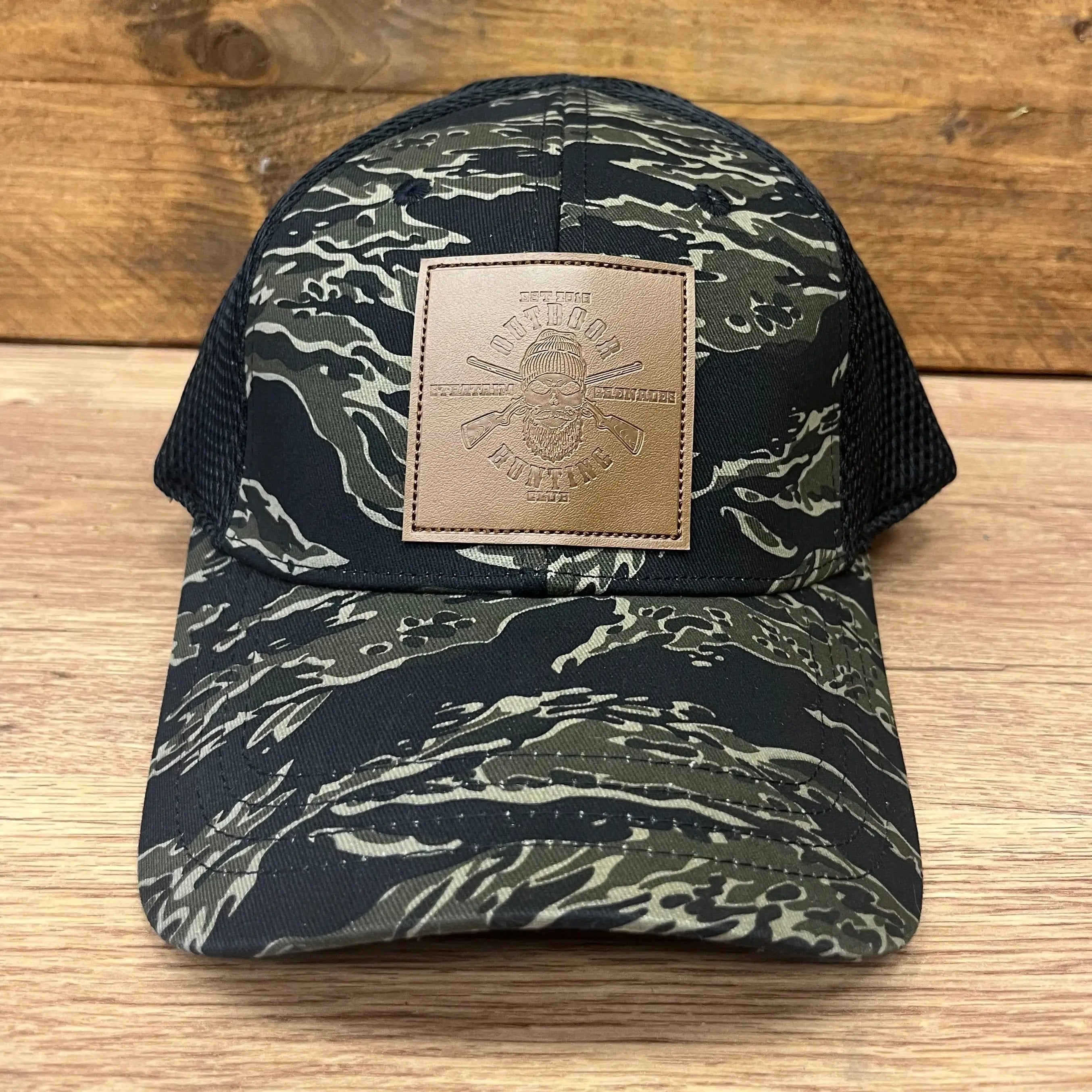 Side view of StratAIM's Tigerstripe Baseball Cap, showcasing the Hunting Club logo and adjustable strap.